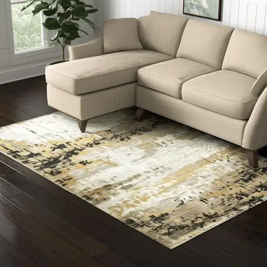 Grey Gold Black Charcoal And Beige Abstract Power Loom Stain Resistant Area Rug With Fringe Photo 1