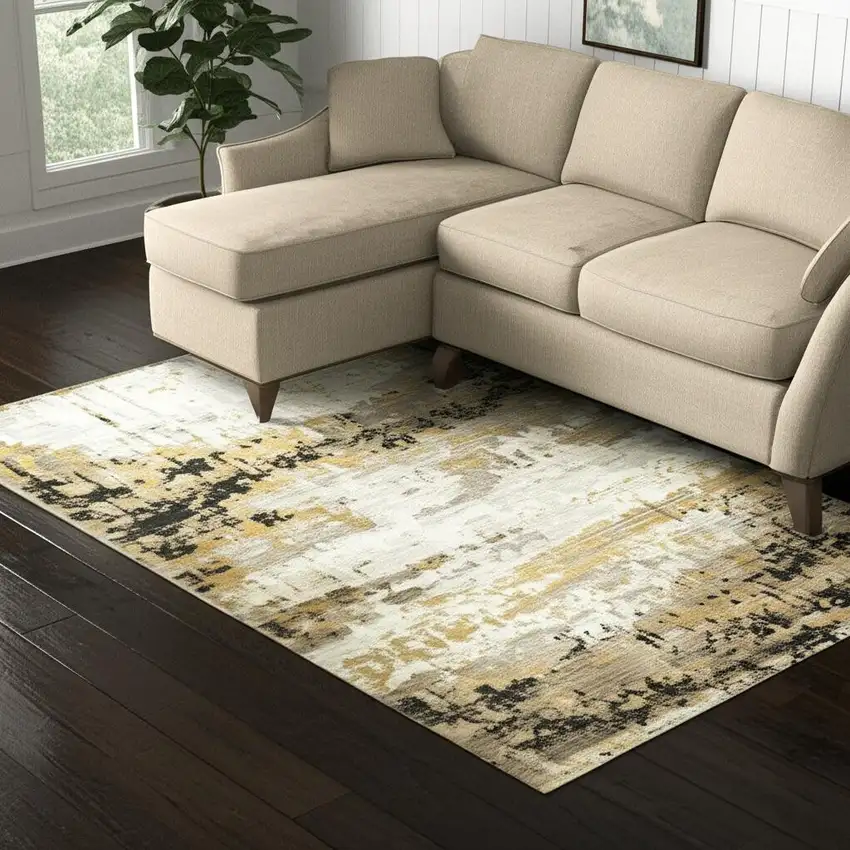 Grey Gold Black Charcoal And Beige Abstract Power Loom Stain Resistant Area Rug With Fringe Photo 1