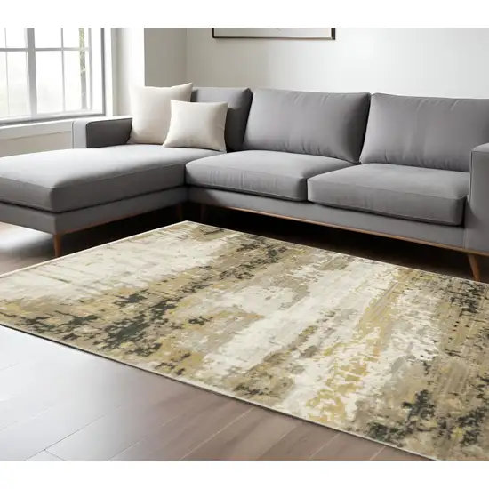 Grey Gold Black Charcoal And Beige Abstract Power Loom Stain Resistant Area Rug With Fringe Photo 1
