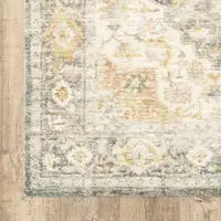 Photo of Grey Gold Orange And Ivory Oriental Power Loom Stain Resistant Area Rug
