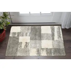 Photo of Grey Ivory And Silver Geometric Shag Power Loom Stain Resistant Area Rug
