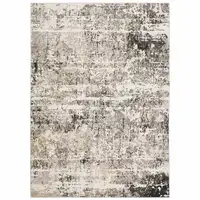 Photo of Grey Ivory Beige Charcoal Black Tan And Brown Abstract Power Loom Stain Resistant Area Rug