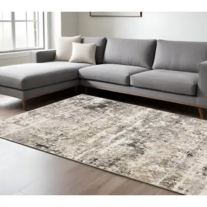 Photo of Grey Ivory Beige Charcoal Black Tan And Brown Abstract Power Loom Stain Resistant Area Rug