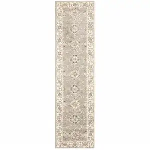 Photo of Grey Ivory Tan Brown And Gold Oriental Power Loom Stain Resistant Runner Rug