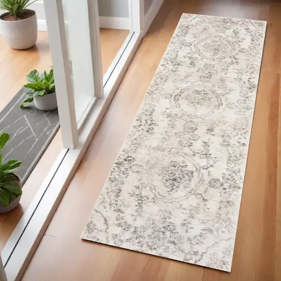 7' Gray And Tan Floral Distressed Runner Rug Photo 1