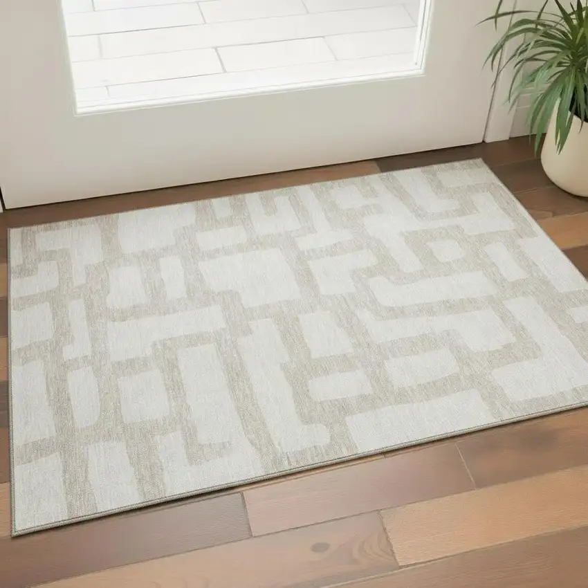 Ivory And Beige Abstract Geometric Washable Area Rug With UV Protection Photo 1