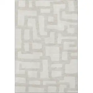 Photo of Ivory And Beige Abstract Geometric Washable Area Rug With UV Protection