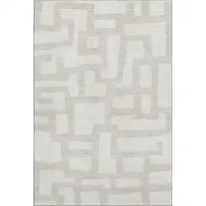 Photo of Ivory And Beige Abstract Geometric Washable Area Rug With UV Protection