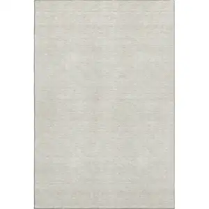 Photo of Ivory And Beige Abstract Geometric Washable Area Rug With UV Protection