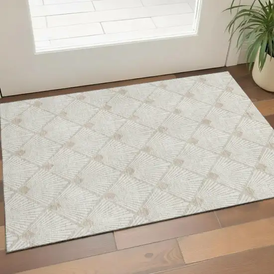 Ivory And Beige Abstract Geometric Washable Area Rug With UV Protection Photo 1