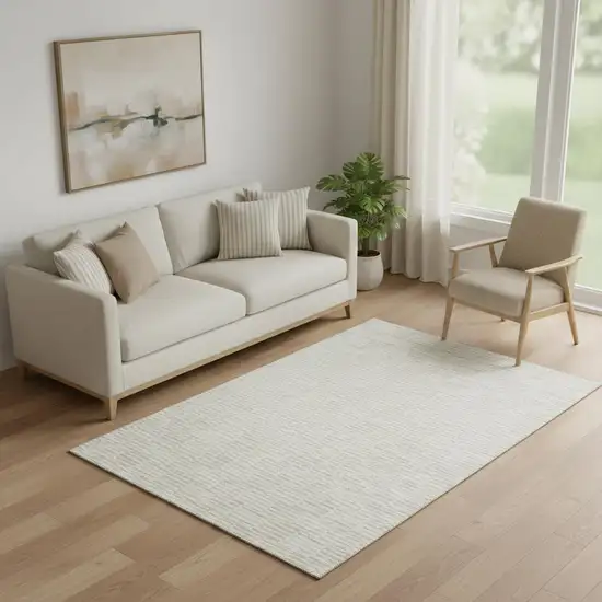 Ivory And Beige Abstract Geometric Washable Area Rug With UV Protection Photo 1