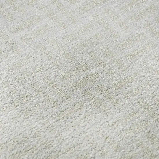 Ivory And Beige Abstract Geometric Washable Area Rug With UV Protection Photo 1