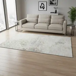 Photo of Ivory And Beige Abstract Washable Area Rug With UV Protection