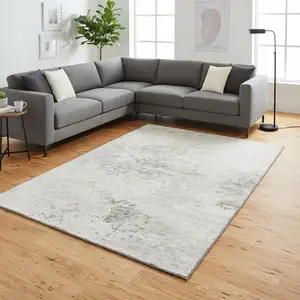 Photo of Ivory And Beige Abstract Washable Area Rug With UV Protection