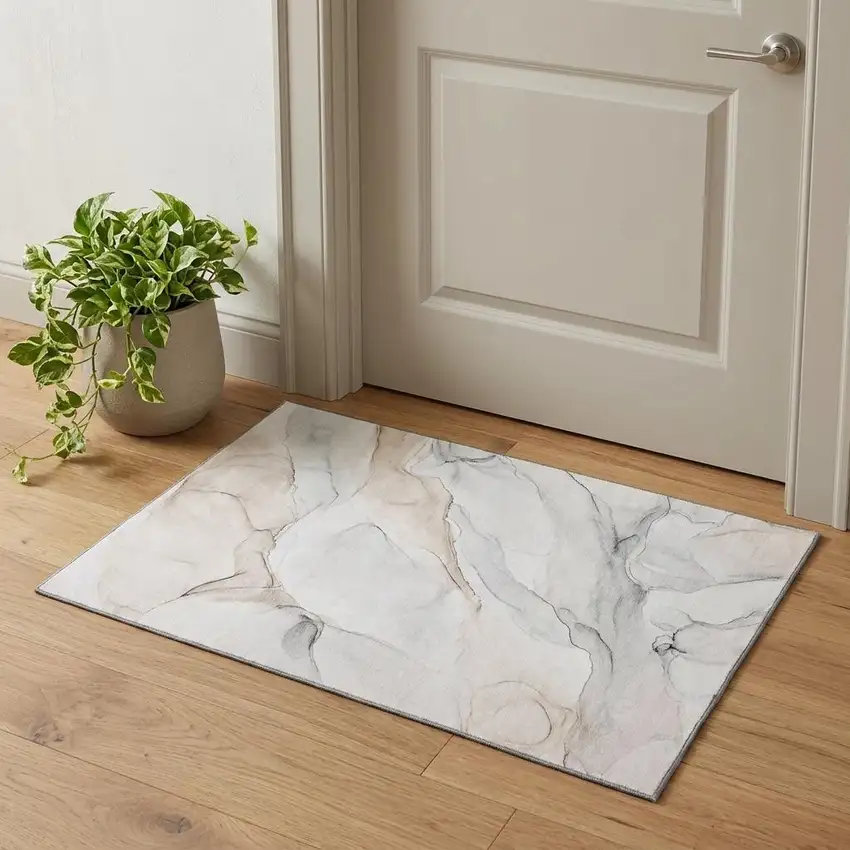Ivory And Beige Abstract Washable Area Rug With UV Protection Photo 1
