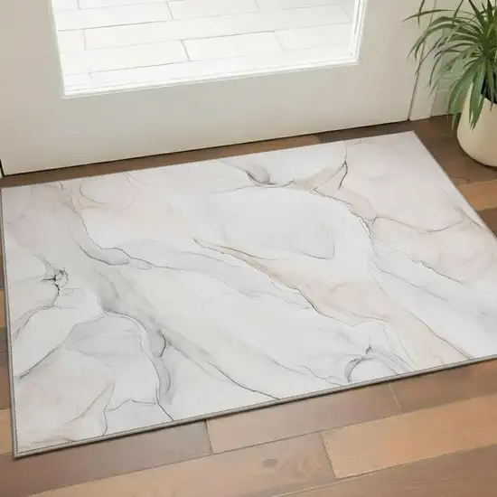 Ivory And Beige Abstract Washable Area Rug With UV Protection Photo 1