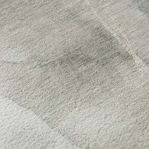 Photo of Ivory And Beige Abstract Washable Area Rug With UV Protection