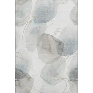 Photo of Ivory And Beige Abstract Washable Area Rug With UV Protection