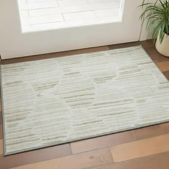 Ivory And Beige Abstract Washable Area Rug With UV Protection Photo 2