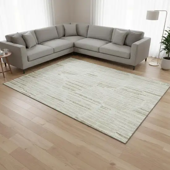 Ivory And Beige Abstract Washable Area Rug With UV Protection Photo 2