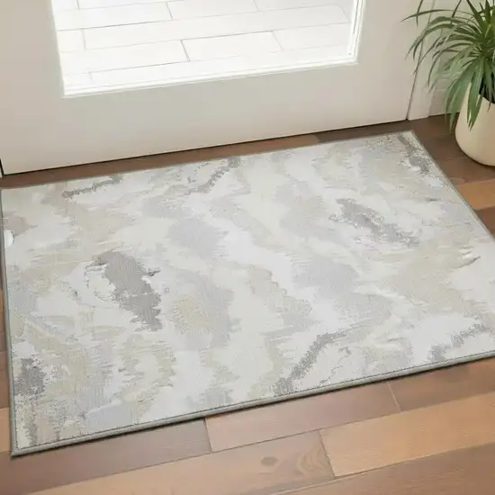 Ivory And Beige Abstract Washable Area Rug With UV Protection Photo 1