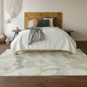 Photo of Ivory And Beige Abstract Washable Area Rug With UV Protection