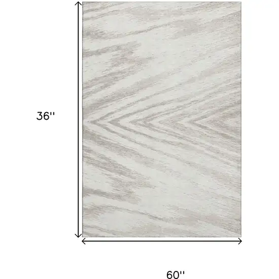 Ivory And Beige Abstract Washable Area Rug With UV Protection Photo 3