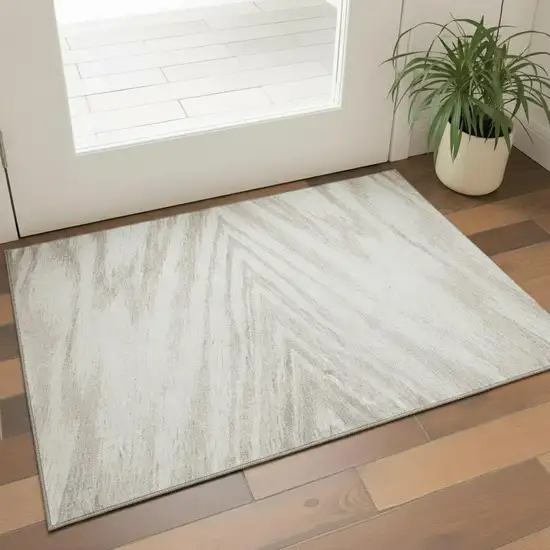 Ivory And Beige Abstract Washable Area Rug With UV Protection Photo 1