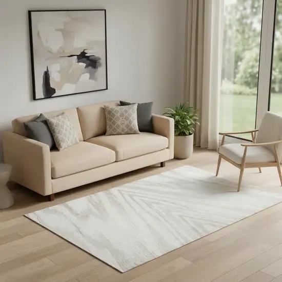 Ivory And Beige Abstract Washable Area Rug With UV Protection Photo 1