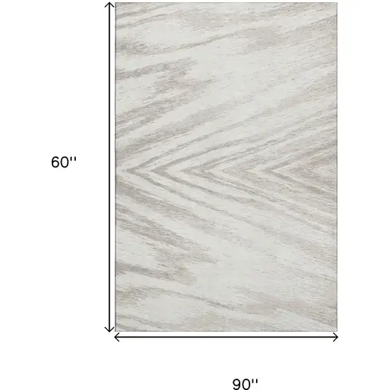 Ivory And Beige Abstract Washable Area Rug With UV Protection Photo 9