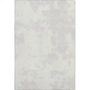 Photo of Ivory And Beige Abstract Washable Area Rug With UV Protection