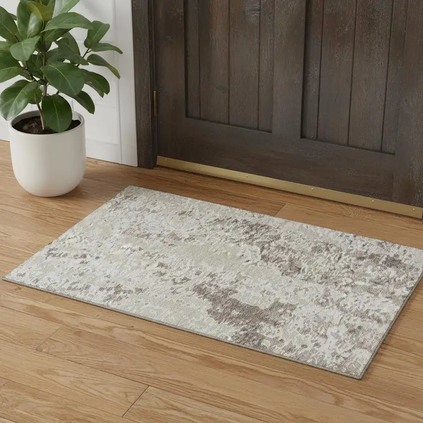 Ivory And Beige Abstract Washable Area Rug With UV Protection Photo 1