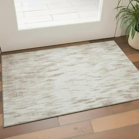 Ivory And Beige Abstract Washable Area Rug With UV Protection Photo 1