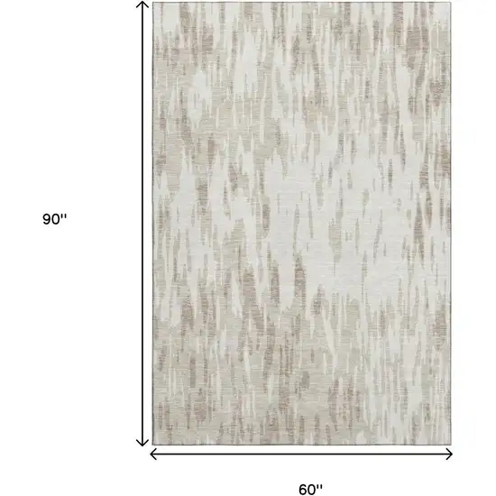 Ivory And Beige Abstract Washable Area Rug With UV Protection Photo 9