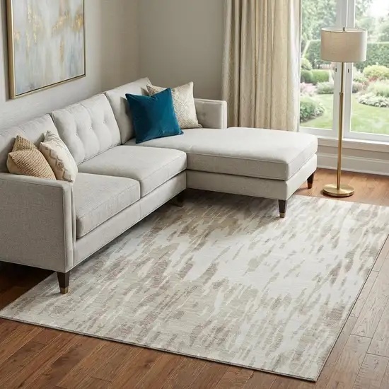 Ivory And Beige Abstract Washable Area Rug With UV Protection Photo 1