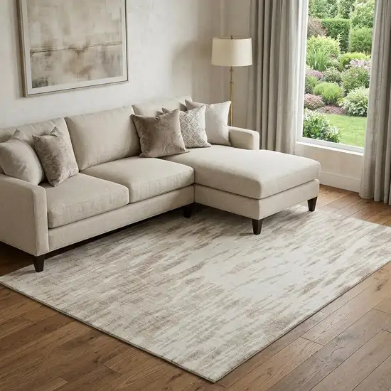 Ivory And Beige Abstract Washable Area Rug With UV Protection Photo 1