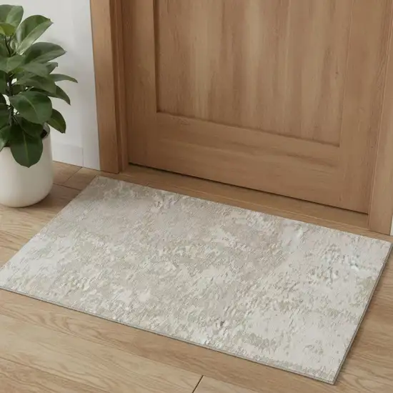 Ivory And Beige Abstract Washable Area Rug With UV Protection Photo 1