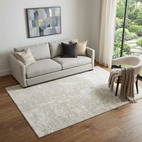 Ivory And Beige Abstract Washable Area Rug With UV Protection Photo 1