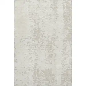 Photo of Ivory And Beige Abstract Washable Area Rug With UV Protection