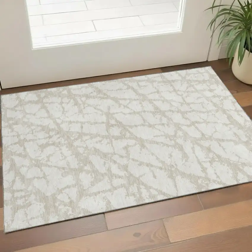 Ivory And Beige Abstract Washable Area Rug With UV Protection Photo 1