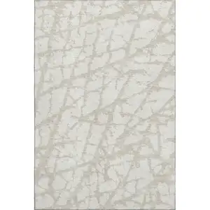 Photo of Ivory And Beige Abstract Washable Area Rug With UV Protection