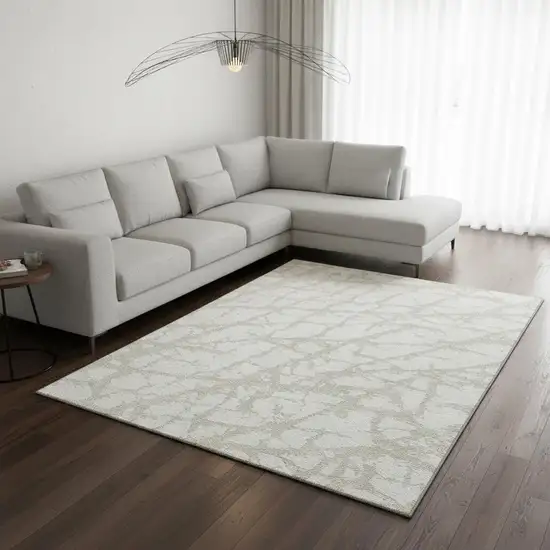 Ivory And Beige Abstract Washable Area Rug With UV Protection Photo 2