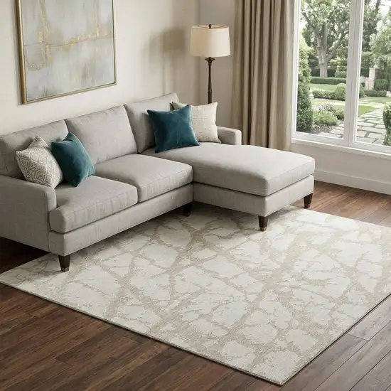 Ivory And Beige Abstract Washable Area Rug With UV Protection Photo 1