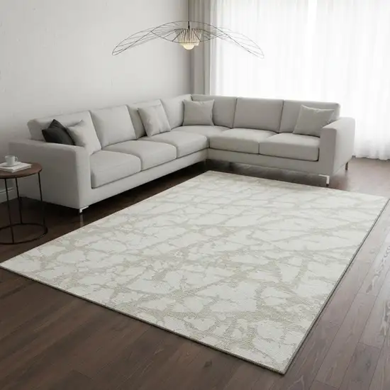 Ivory And Beige Abstract Washable Area Rug With UV Protection Photo 2