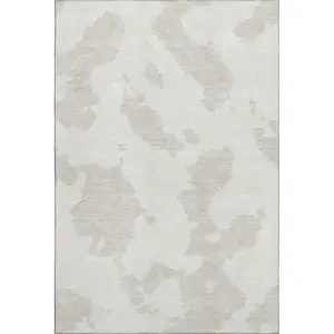 Photo of Ivory And Beige Abstract Washable Area Rug With UV Protection