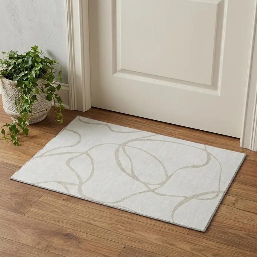 Ivory And Beige Abstract Washable Area Rug With UV Protection Photo 1