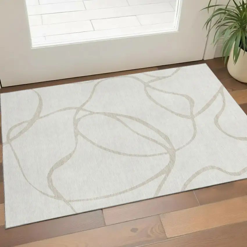 Ivory And Beige Abstract Washable Area Rug With UV Protection Photo 1