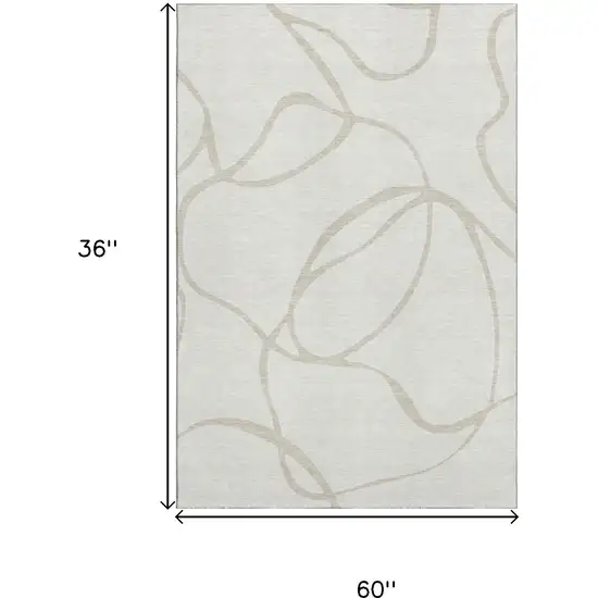 Ivory And Beige Abstract Washable Area Rug With UV Protection Photo 9