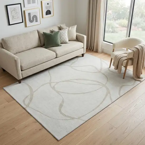 Ivory And Beige Abstract Washable Area Rug With UV Protection Photo 1
