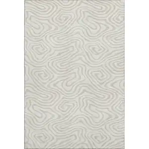 Photo of Ivory And Beige Abstract Washable Area Rug With UV Protection